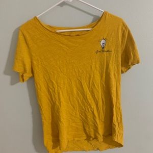 Yellow free thinker shirt.